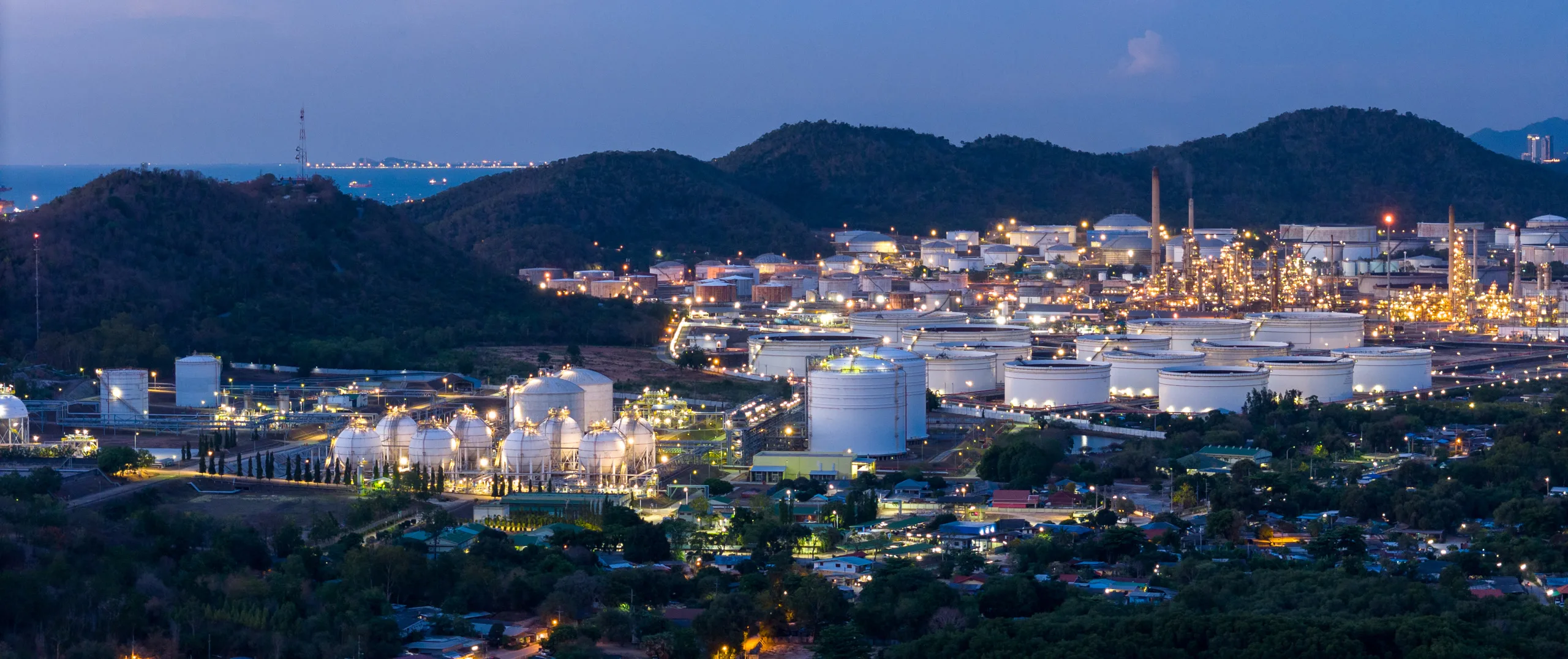 Industrial facility at night representing commercial and industrial power challenges